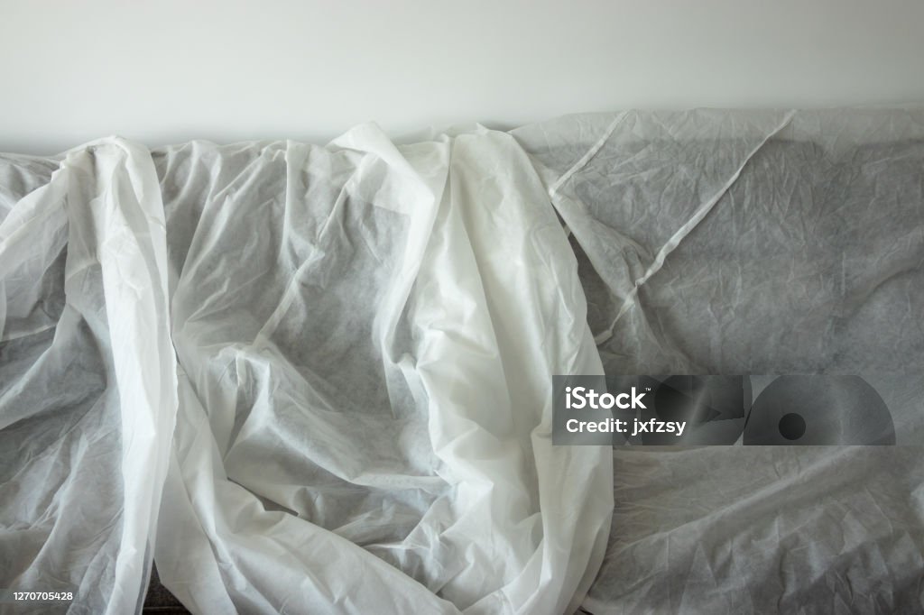 sofa covered with white cloth in homedecoration Apartment Stock Photo