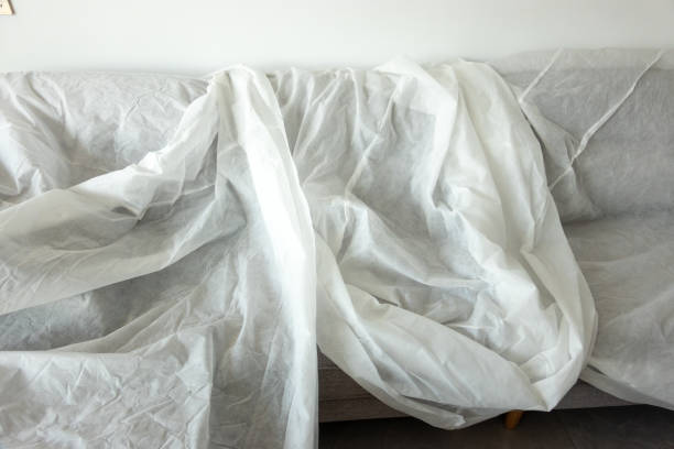 istock sofa covered with white cloth in homedecoration 1270705443