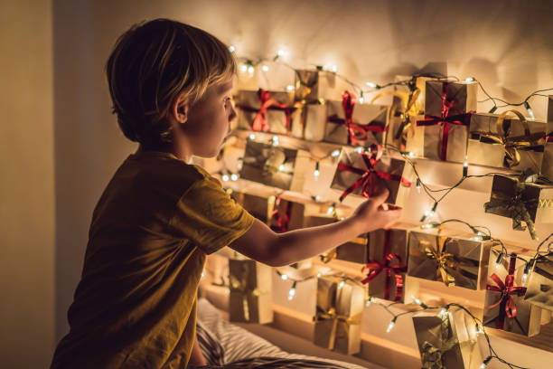 istock The boy opens a gift from the advent calendar 1270712678