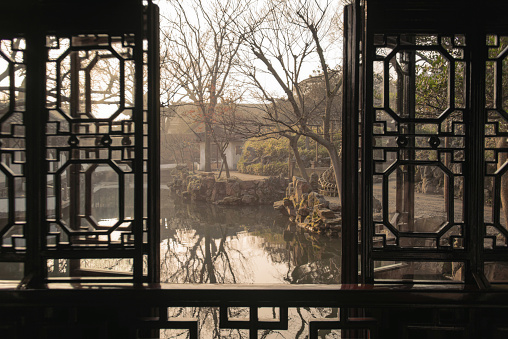 The window view at Humble Administrator Garden(Zhuozheng Garden) in early morning.Zhuozheng Garden a classical garden,in UNESCO World Heritage Site and is the most famous of the gardens of Suzhou.