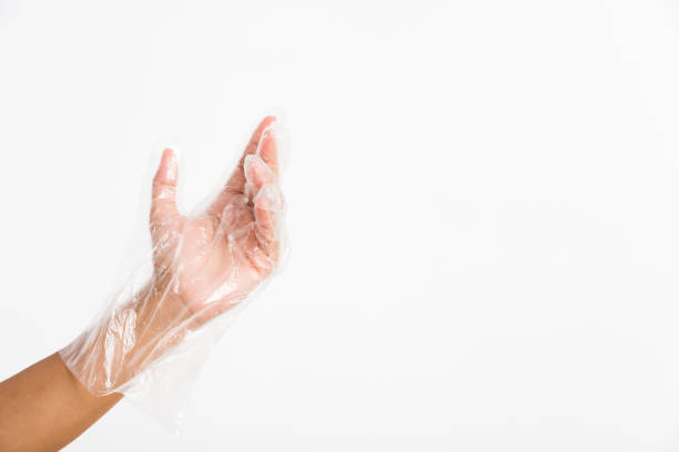 istock Woman hand wearing single use protect disposable transparent plastic glove 1270713470