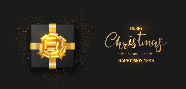 istock Christmas banner. Gift box decorated with gold bow-ribbon isolated on black background. Vector illustration. 1270723022