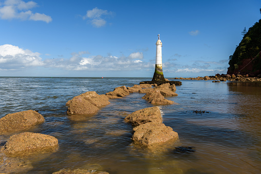 Small white lighthouse on the coast at Shaldon
