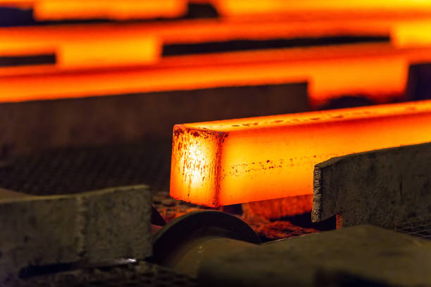 istock Hot square steel bloom on the roll-table. 1270735925