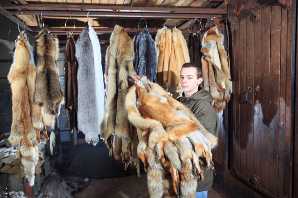 istock A young man hangs up the fur after treatment. 1270737555