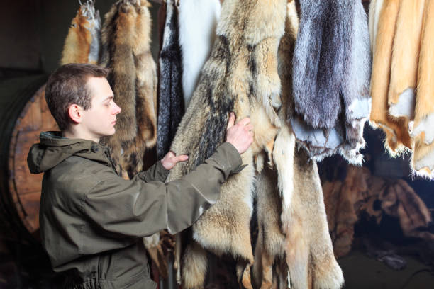 istock A young guy combs the fur of a special, metal comb. 1270737564