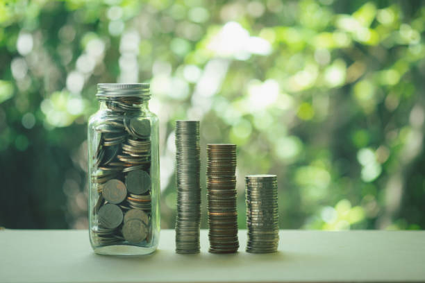 istock Thai coin in glass bottle with money stack step up growing growth saving money. The concept financial 1270737653
