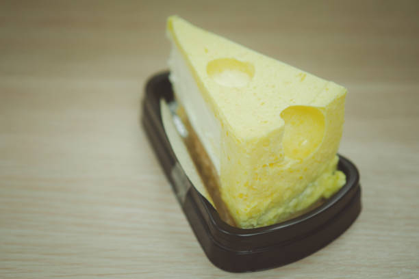 istock Triangle cheesecake in package put on wood table ready to eat 1270737683