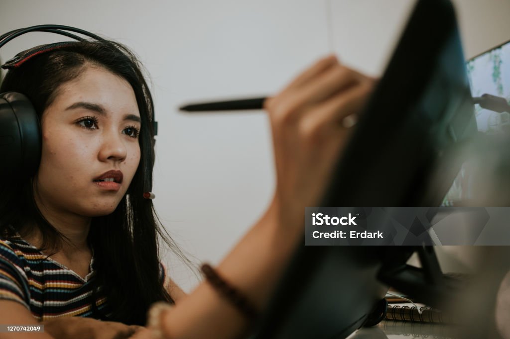 Gamer and animator designer with moment of thinking-stock photo The passion of young Asian creative designer  is drawing her upcoming ideas at her living room, Bangkok Thailand Animator Stock Photo