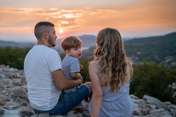 istock Young parents relaxing in nature with their little son 1270742946