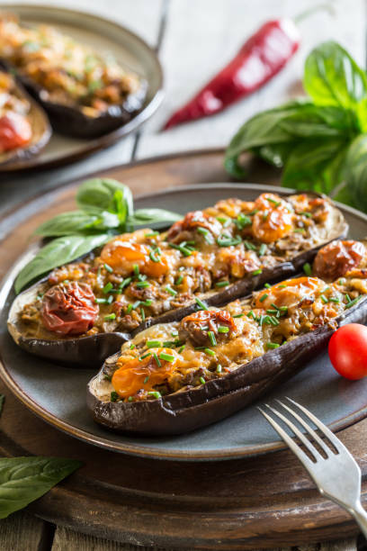 istock Baked eggplant. aubergine stuffed with vegetables and cheese 1270742987