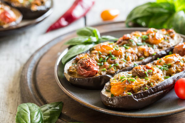 istock Baked eggplant. aubergine stuffed with vegetables and cheese 1270742997