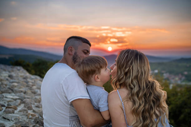 istock Little son kissing his mother 1270743019