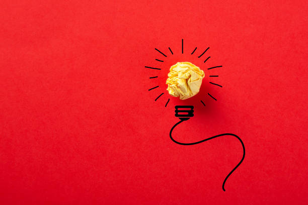 istock Creative idea, Inspiration, New idea and Innovation concept with Crumpled Paper light bulb on red background. 1270744045