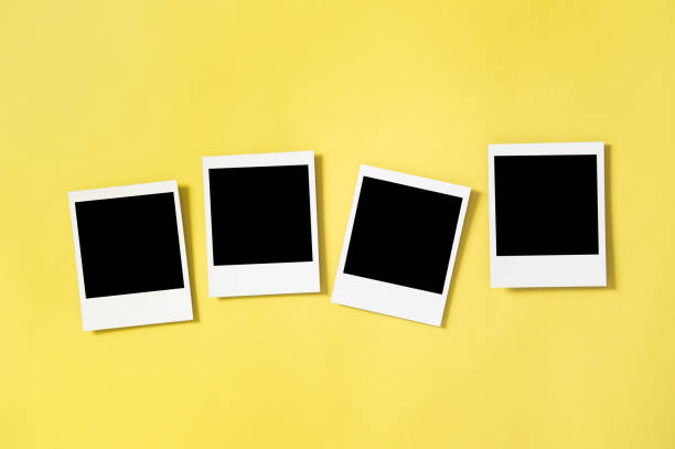 istock Retro style photo frames yellow background 1270744913