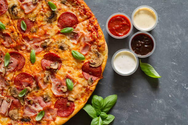 istock Pizza with extra sauces and empty space still life 1270745940