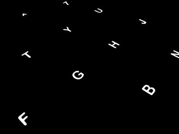 Creative fine art image illustration of white glowing English alphabet letters on dark black background Copy space for text. Modern abstract front style in computer keyboard typewriter sequence order. ilustración creativa de imágenes de bellas artes de letras blancas del alfabeto inglés brillante sobre fondo negro oscuro copiar espacio para texto. estilo frontal abstracto moderno en orden de secuencia de máquina de escribir del teclado del ordenador