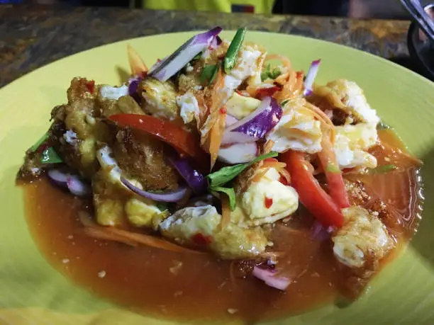 "fried-egg spicy salad" is a Thai dish made out of fried chicken or duck eggs.