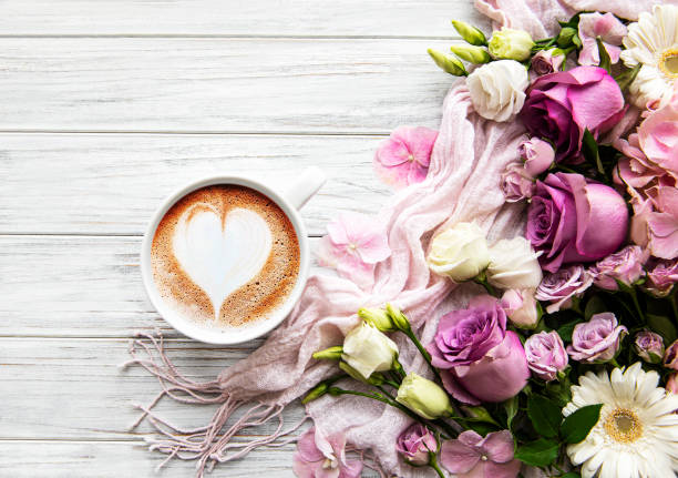 istock Pink flowers and cup of coffee 1270747782