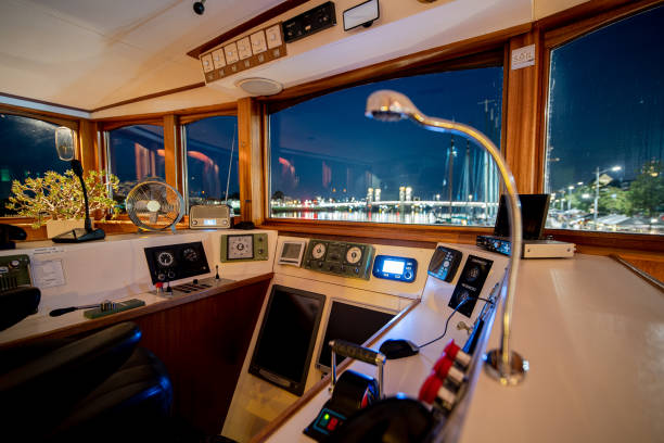 istock Captain's cabin with steering wheel and navigation equipment 1270749128
