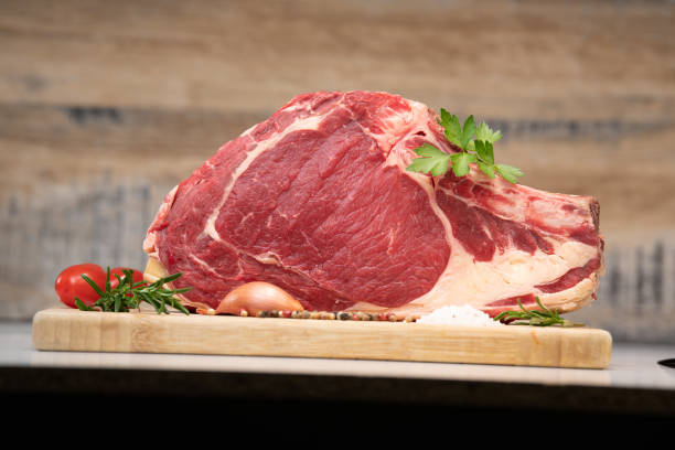 istock Raw T Bone steak on wooden board prepared to Grill 1270749146