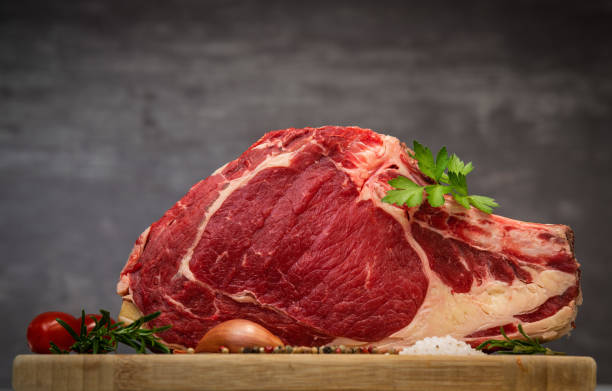 istock Raw T Bone steak on wooden board prepared to Grill 1270749680