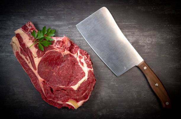 istock Raw T Bone steak on wooden board prepared to Grill 1270750056