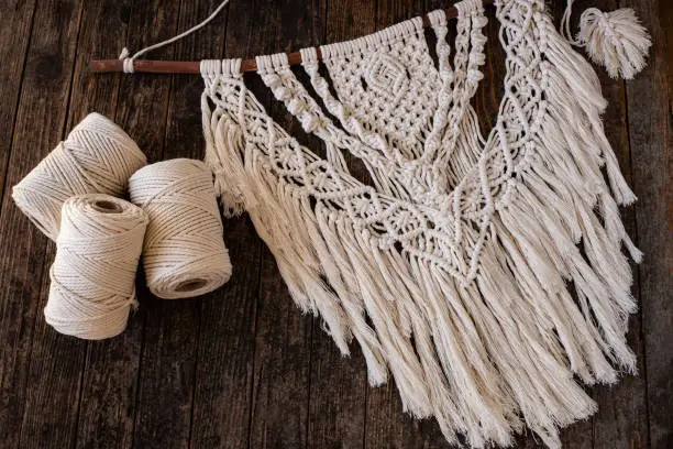 Photo of Weaving macrame at home.