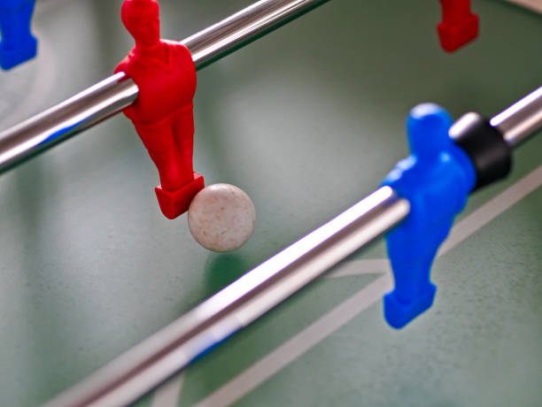istock Table soccer figures in the colors red and blue with ball 1270753077