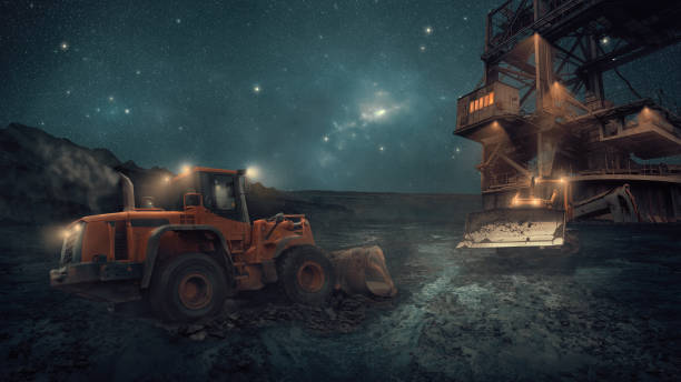 istock Heavy equipment vehicles at night on a construction site 1270754308