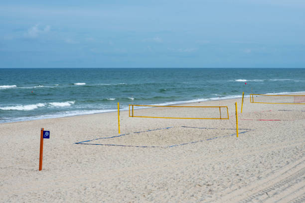 istock Volleyball sign and net on the empty beach 1270759449