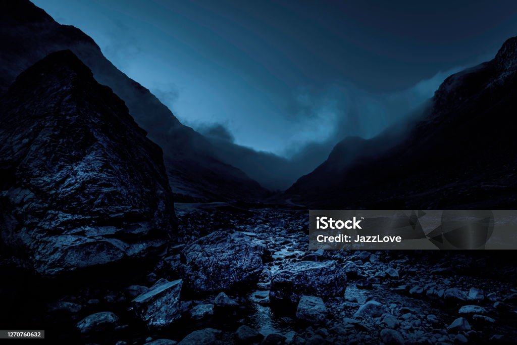 Honister pass in Lake District, Cumbria,UK Honister pass in Lake District, Cumbria,UK.Foggy mountain pass.Dark and dramatic landscape image with atmospheric mood.Bad weather in the mountains. Dark Stock Photo