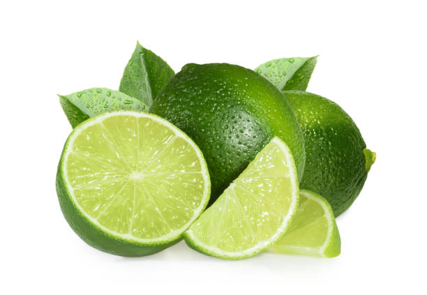 limes isolato su sfondo bianco - lemon portion cross section isolated foto e immagini stock