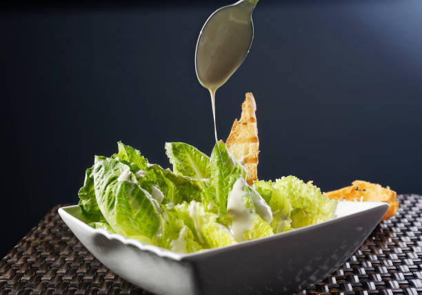 istock Cesar salad with lemon dressing, walnuts and cheese-toasted bread. 1270761705