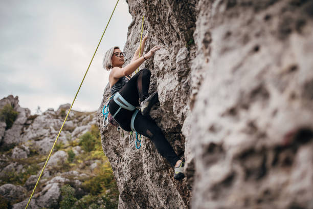 istock Young woman climbing on rocks in nature 1270763888