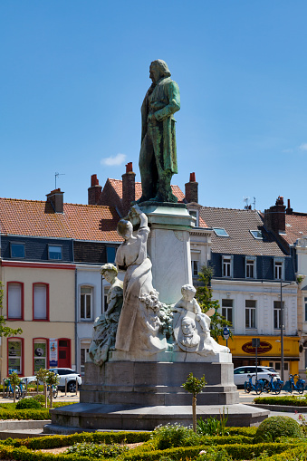 Calais, France - June 22 2020: The Jacquard Monument, created by sculptor Marius Roussel, was inaugurated in front of the Grand Théâtre in 1910.