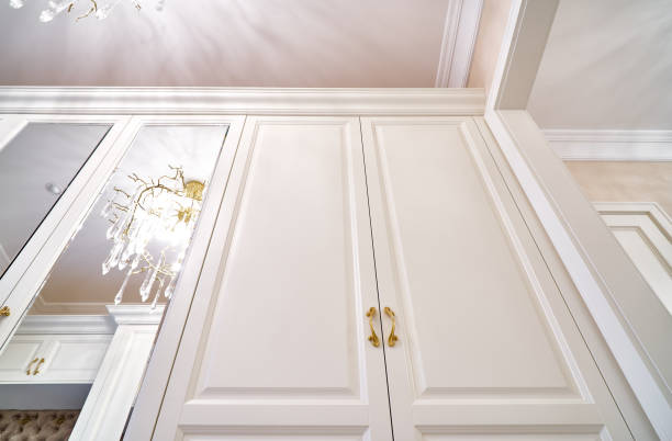 istock Classic white wardrobe with mirror doors in contemporary bright hallway 1270766445