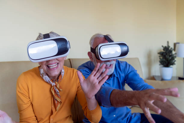 istock Excited Senior Couple is Experiencing Games on Virtual Reality Simulator with VR Glasses. 1270768927