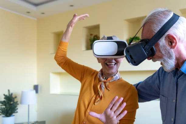 istock Excited Senior Couple is Using VR Goggles and Gesturing with Their Hands. 1270768956
