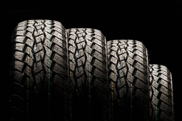 istock four off-road tires close-up on a black background 1270769145