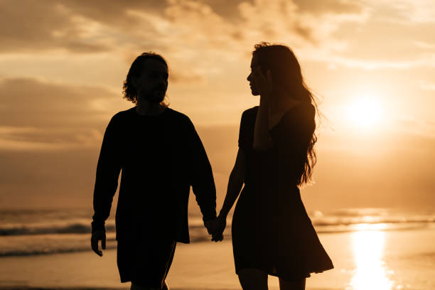 istock Attractive man and woman enjoying romantic evening on sunset 1270772968