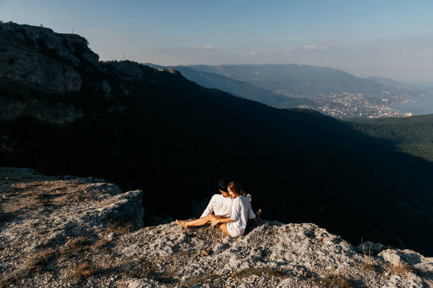 istock Couple having rest on the top of mountain 1270773002