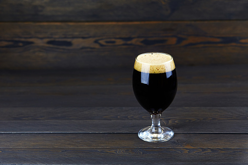 A glass of dark beer