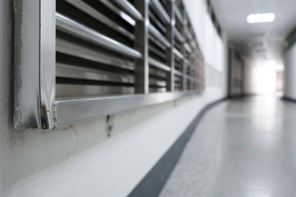 istock Close up on metal railing. The function is protection. Usually installed outside the window or door. The subject is on the left. Low angle. The blurred background is Long corridor. 1270774224