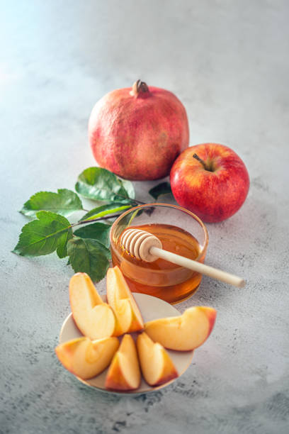 istock Apples, pomegranate and honey for Rosh Hashanah 1270774433