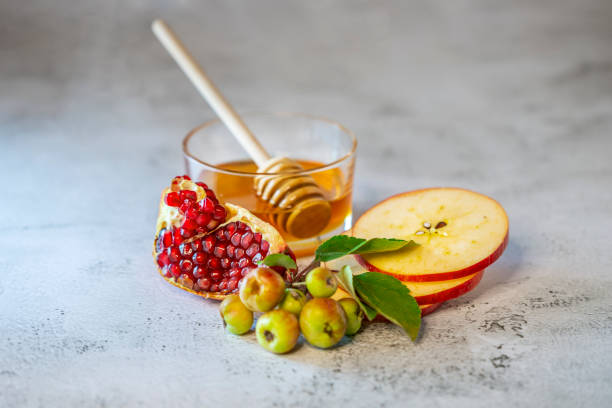 istock Apples, pomegranate and honey for Rosh Hashanah 1270774443