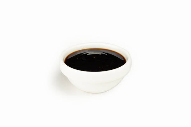 Teriyaki sauce in a bowl on a white background. For the restaurant menu. Traditional Japanese sushi seasoning. Healthy eating. Teriyaki sauce in a bowl on a white background. For the restaurant menu. Traditional Japanese sushi seasoning. Healthy eating hoisin sauce stock pictures, royalty-free photos & images