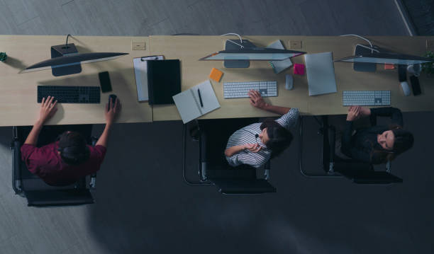 istock Top view young customer services care operators working night shift in call center for helping assistance client in workplace at night time 1270779672