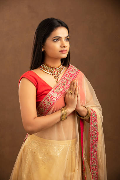 istock Pretty Indian young woman praying 1270779788