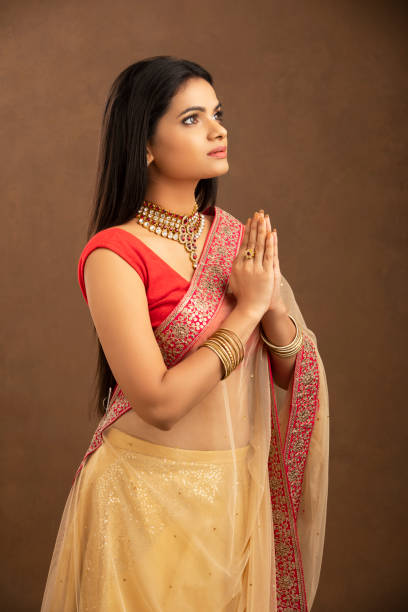 istock Pretty Indian young woman praying 1270779791